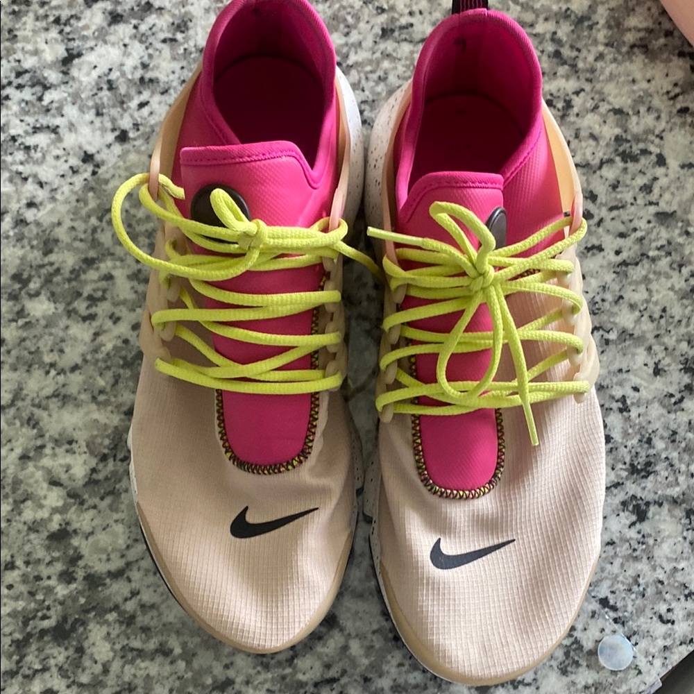 Nike Pink and Tan Athletic Shoes Sleek Design